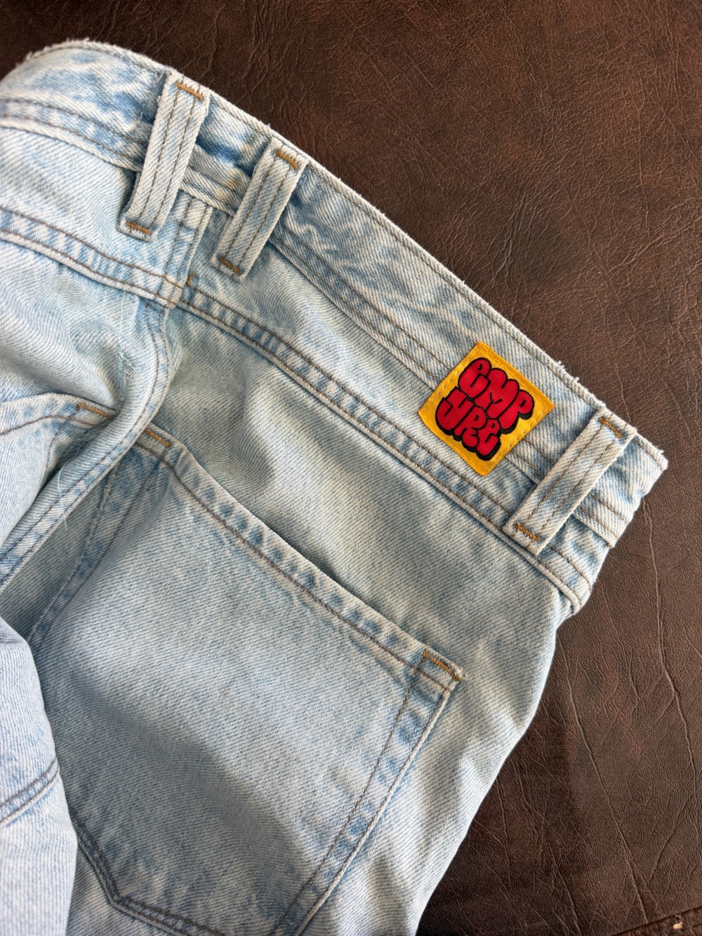 Empyre Light Wash Jeans with Yellow & Red Patch